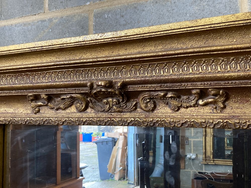 A gilt-framed overmantel mirror, width 138cm, height 91cm